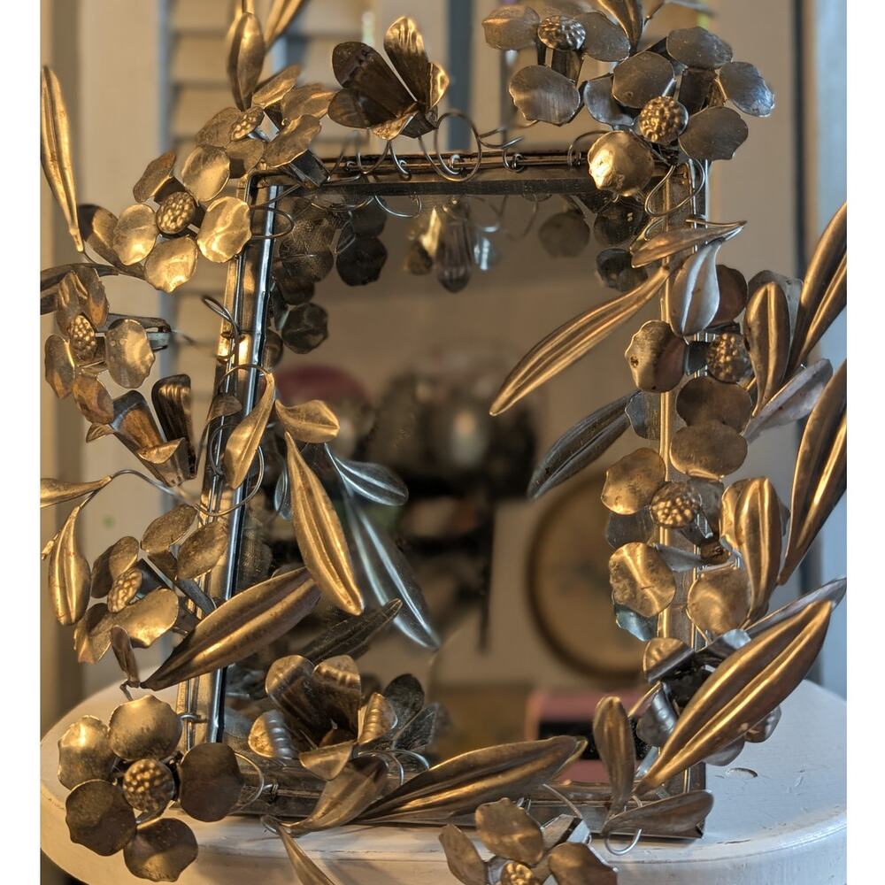 Vintage handcrafted silver-toned floral toleware mirror